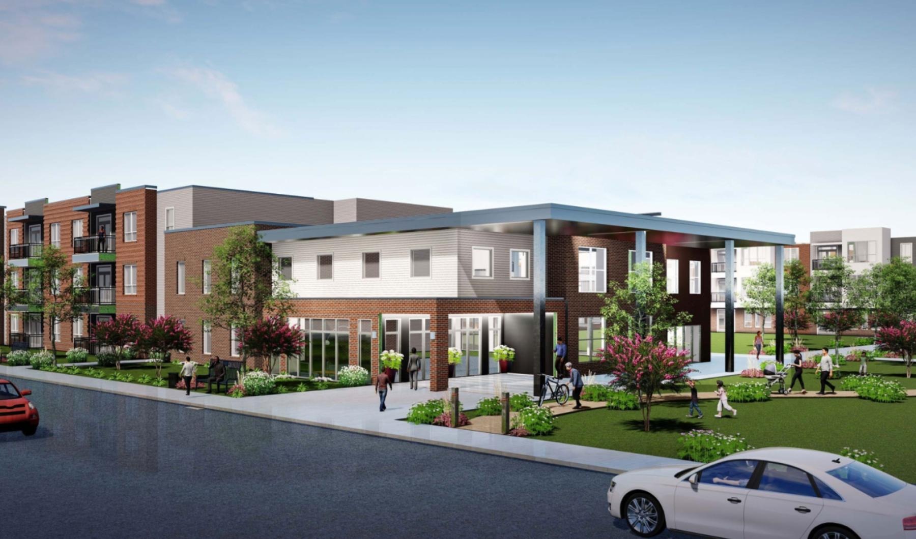 a building with a parking lot and cars in front